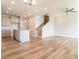 Open-concept layout showcasing the kitchen and living room with hardwood floors and natural light at 125 Brown Swiss Cir, Summerville, SC 29483