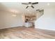 Spacious room showcasing the kitchen, living room, and stairs, all featuring hardwood floors at 125 Brown Swiss Cir, Summerville, SC 29483