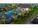 Aerial view of a resort-style pool, surrounded by palm trees and lush landscaping, near ample parking at 125 Brown Swiss Cir, Summerville, SC 29483