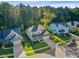 Inviting two-story home with a well-manicured lawn, attached garage, and beautifully landscaped front yard in a tranquil neighborhood at 132 Daniels Ridge Dr, Summerville, SC 29485