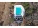 Aerial view showcases community amenities: a refreshing pool and playground, surrounded by lush greenery and a white fence at 132 Daniels Ridge Dr, Summerville, SC 29485