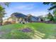 Expansive backyard with lush green grass, a patio, and a fenced perimeter at 132 Daniels Ridge Dr, Summerville, SC 29485
