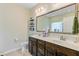 Bathroom featuring double sink vanity with a framed mirror, decorative shelves, and modern fixtures at 132 Daniels Ridge Dr, Summerville, SC 29485