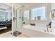 Bright bathroom with a glass-enclosed shower and luxurious soaking tub by a window at 132 Daniels Ridge Dr, Summerville, SC 29485