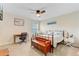 Well-lit bedroom showcasing a decorative bed frame, wooden bench, desk, and a ceiling fan at 132 Daniels Ridge Dr, Summerville, SC 29485