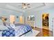 Spacious bedroom featuring tray ceilings, wood floors, a king bed, and a walk-in closet at 132 Daniels Ridge Dr, Summerville, SC 29485
