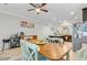 Open-concept dining area flowing into the kitchen, complete with a wine rack, and a wooden dining table at 132 Daniels Ridge Dr, Summerville, SC 29485