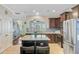 This kitchen features granite countertops, stainless steel appliances, a kitchen island, and dark wood cabinets at 132 Daniels Ridge Dr, Summerville, SC 29485