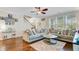 Comfortable living room with a sectional sofa, hardwood floors, and access to staircase at 132 Daniels Ridge Dr, Summerville, SC 29485