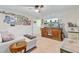 Cozy living room featuring a ceiling fan, large TV, and comfortable seating at 132 Daniels Ridge Dr, Summerville, SC 29485