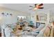 Bright living room with hardwood floors, ceiling fan, and comfortable sectional sofa at 132 Daniels Ridge Dr, Summerville, SC 29485