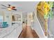 Spacious living room with hardwood floors, staircase, and view into the kitchen at 132 Daniels Ridge Dr, Summerville, SC 29485