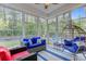 A beautiful sunroom featuring large windows, comfortable seating, and views of the outdoors at 132 Daniels Ridge Dr, Summerville, SC 29485