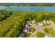 Aerial view of homes in a lakeside community surrounded by lush greenery at 133 Hanahan Plantation Cir, Hanahan, SC 29410