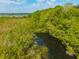 Beautiful aerial view of property with private dock in tranquil, wooded location on the water at 133 Hanahan Plantation Cir, Hanahan, SC 29410