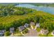 Aerial view of homes in a lakeside community surrounded by lush greenery at 133 Hanahan Plantation Cir, Hanahan, SC 29410