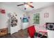 Bright bedroom features cheerful decor, laminate floors, and a ceiling fan, creating a cozy and personalized space at 133 Hanahan Plantation Cir, Hanahan, SC 29410