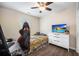 Modern bedroom with sleek flooring and natural light boasts a ceiling fan and a comfortable setting for relaxation at 133 Hanahan Plantation Cir, Hanahan, SC 29410