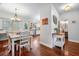 Cozy dining area with wood floors adjacent to the kitchen, perfect for Gathering meals and entertaining guests at 133 Hanahan Plantation Cir, Hanahan, SC 29410