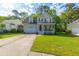 Charming two-story home with a front porch, garage, and well-maintained lawn in a sunny neighborhood at 133 Hanahan Plantation Cir, Hanahan, SC 29410