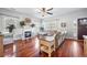 Warm living room with hardwood floors, a fireplace, and comfortable seating for relaxing and entertaining at 133 Hanahan Plantation Cir, Hanahan, SC 29410