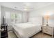Well-lit bedroom with plantation shutters, neutral decor, and ceiling fan at 1362 Palm Cove Dr, Charleston, SC 29492