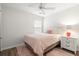 Comfortable bedroom with neutral tones, soft pink accents, and hardwood floors at 1362 Palm Cove Dr, Charleston, SC 29492