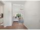 Inviting hallway with wood floors leading to a living room with lots of natural light at 1362 Palm Cove Dr, Charleston, SC 29492