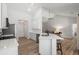 Bright kitchen features stainless appliances, white cabinets, and bar-stool seating at 1362 Palm Cove Dr, Charleston, SC 29492