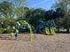 Community playground with colorful play structures and a soft, safe ground cover at 1362 Palm Cove Dr, Charleston, SC 29492