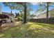 Spacious backyard with a well-maintained lawn, a patio area, and a charming wooden fence at 1379 Downsberry Dr, Mount Pleasant, SC 29466