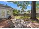 Relaxing backyard area, with a patio, green lawn, mature trees, and a fenced perimeter for privacy at 1379 Downsberry Dr, Mount Pleasant, SC 29466