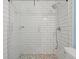 Bright bathroom showcasing walk-in shower with white subway tile and attractive mosaic tile flooring at 1379 Downsberry Dr, Mount Pleasant, SC 29466