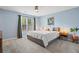 Calming primary bedroom with neutral tones, plush carpet, and a large window providing natural light at 1379 Downsberry Dr, Mount Pleasant, SC 29466