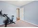 Spare bedroom or home gym with wall mounted tv and YESOUL stationary bike, carpeted floors at 1379 Downsberry Dr, Mount Pleasant, SC 29466