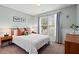 Inviting bedroom features a cozy bed, a large window, and a calming color scheme perfect for relaxation at 1379 Downsberry Dr, Mount Pleasant, SC 29466