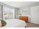 Charming bedroom with natural light, a classic dresser, and a view overlooking the serene outdoors at 1379 Downsberry Dr, Mount Pleasant, SC 29466