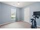 Comfortable bedroom with ample natural light, carpeted floors and a YESOUL stationary bike at 1379 Downsberry Dr, Mount Pleasant, SC 29466