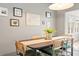 Dining area with six chairs, light fixture, and artwork on the wall at 1379 Downsberry Dr, Mount Pleasant, SC 29466