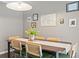Dining area with six chairs, light fixture, and artwork on the wall at 1379 Downsberry Dr, Mount Pleasant, SC 29466