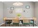 Cozy dining area with hardwood floors, modern table and chairs, and stylish decor at 1379 Downsberry Dr, Mount Pleasant, SC 29466