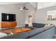 Living room features a high ceiling, fan, large sectional, and views to the kitchen at 1379 Downsberry Dr, Mount Pleasant, SC 29466