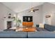 Vaulted ceiling living room with fireplace, hardwood floors, large windows and contemporary decor at 1379 Downsberry Dr, Mount Pleasant, SC 29466