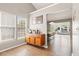 Living room with hardwood floors, windows, and a sideboard with decor at 1379 Downsberry Dr, Mount Pleasant, SC 29466