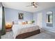 Cozy main bedroom with a ceiling fan, decorative wall art and neutral colors at 1379 Downsberry Dr, Mount Pleasant, SC 29466