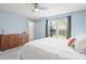 Bright main bedroom with a dresser, large window and plush carpet at 1379 Downsberry Dr, Mount Pleasant, SC 29466