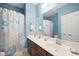 Bathroom with double sink vanity, decorative shower curtain, and modern fixtures at 1440 Teaberry Path, Charleston, SC 29414