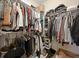 Walk-in closet with custom shelving and ample storage space for clothes and shoes at 1440 Teaberry Path, Charleston, SC 29414