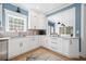 Bright kitchen with white cabinets, granite countertops, and stainless steel appliances at 1440 Teaberry Path, Charleston, SC 29414