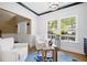Cozy living room featuring sunlit windows, comfortable chairs, and stylish decor at 1440 Teaberry Path, Charleston, SC 29414